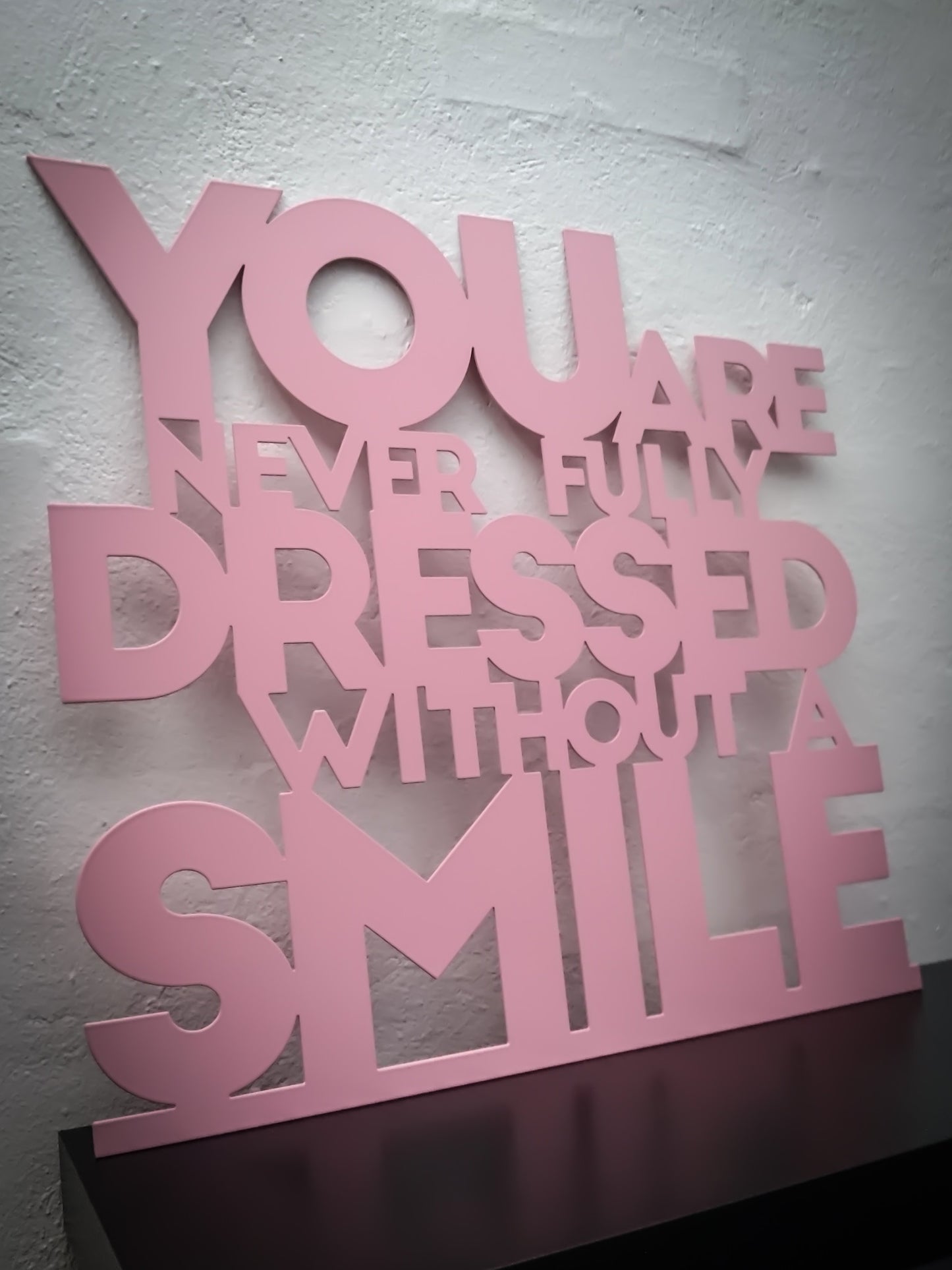You are never fully dressed without a smile - Pink varnished 52.5x50cm