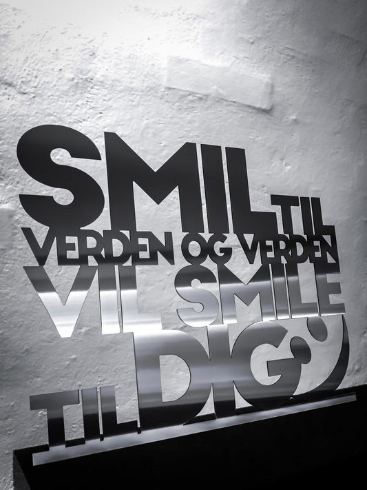 Smile to the world and the world will smile to you - Stainless steel 62x50cm